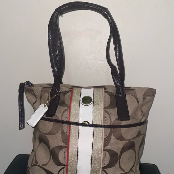 Gorgeous never worn Coach monogram tote bag with white patent leather stripe!